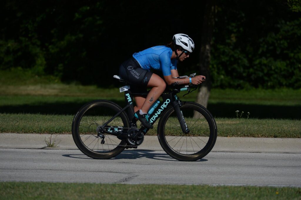 girl racing triathlon bike