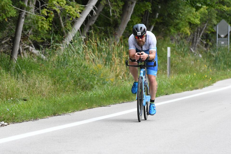 man riding a triathlon bike