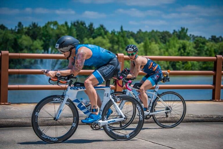 man riding triathlon bike in an ironman race