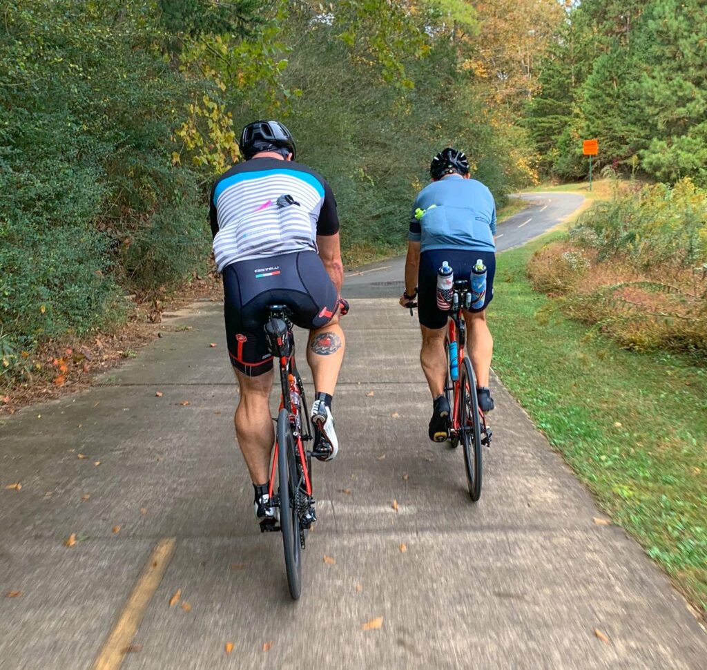 two men riding bikes
