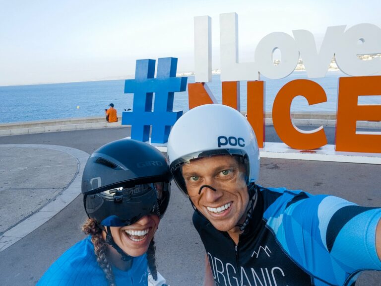 Woman and man with bike helmets on smiling