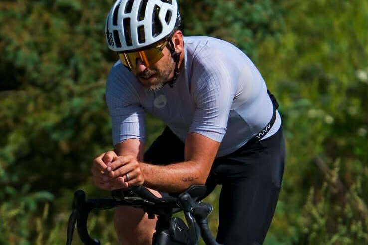 Man riding road bike in a triathlon race