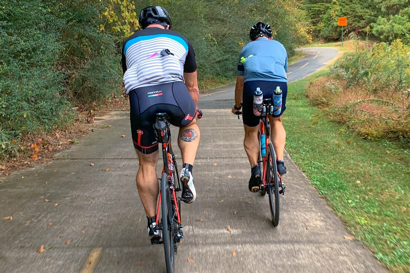 two men riding bikes